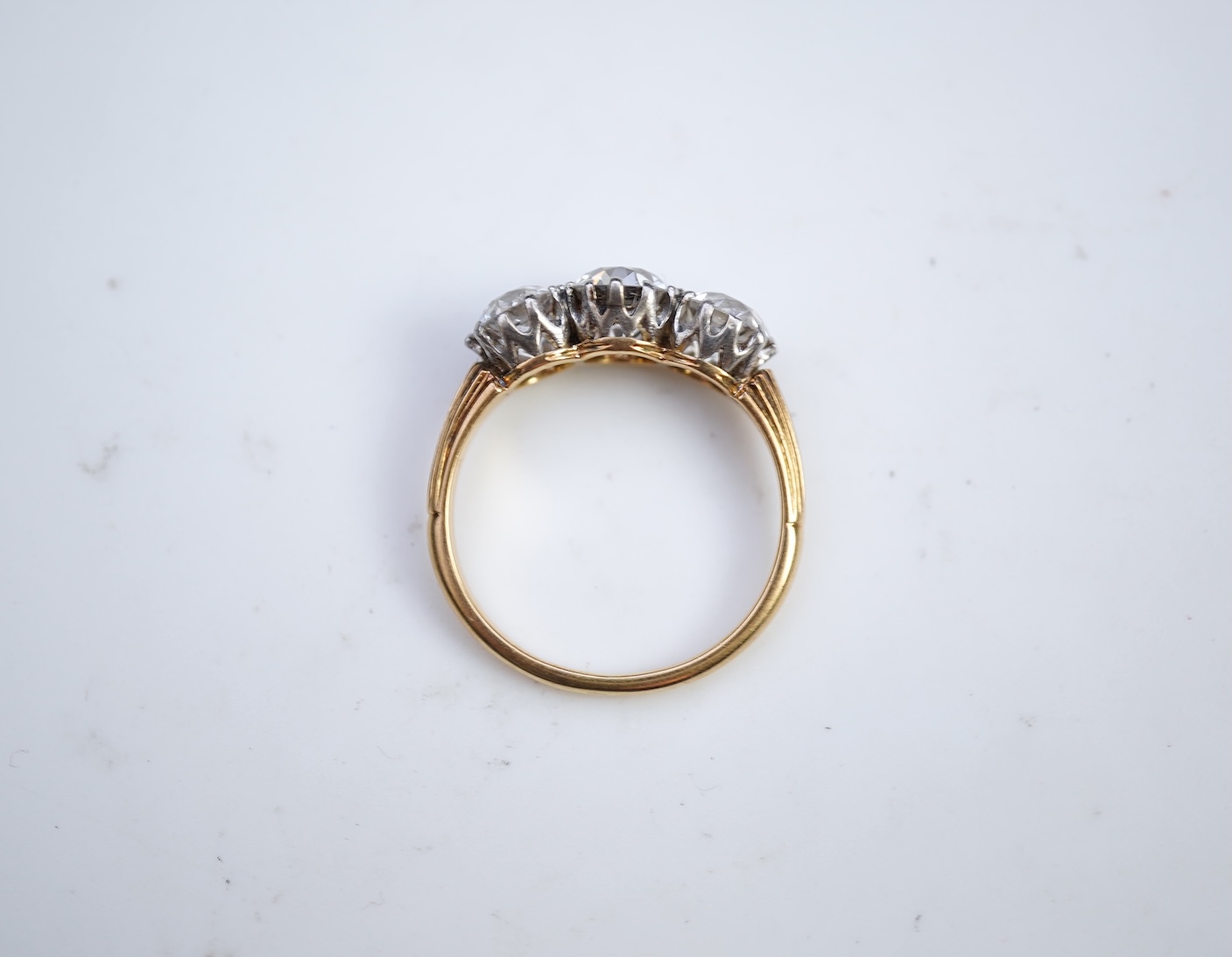 An attractive three-stone diamond ring, early 20th century